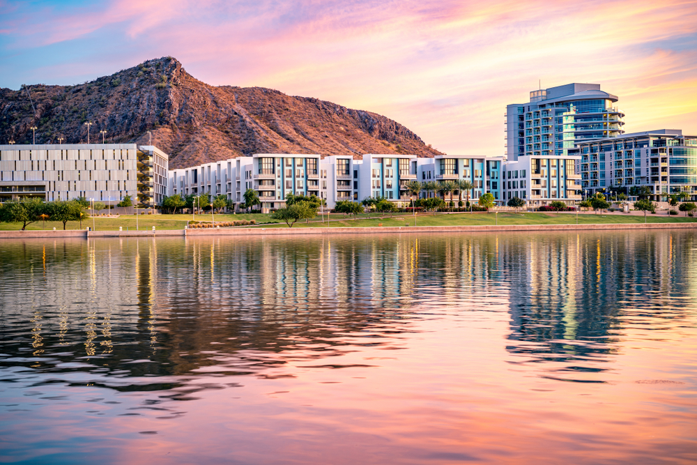 view of buildings in front of Tempe Town Lake during sunset
