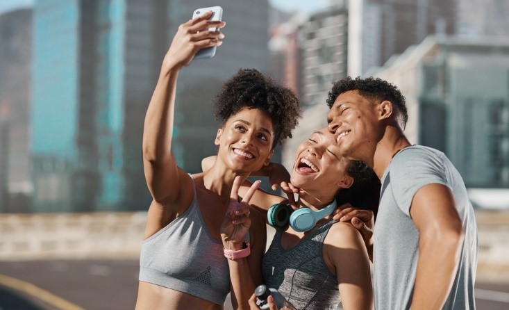 diverse people taking a selfie after exercising