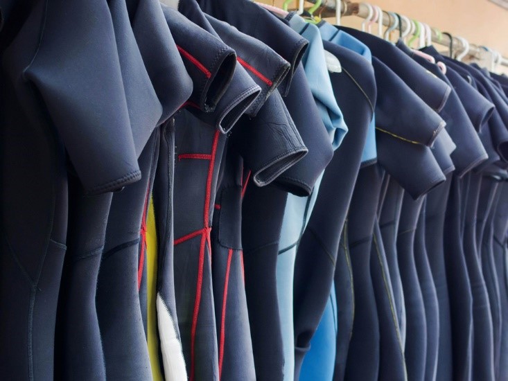 wetsuits hanging