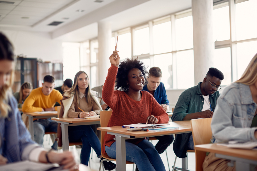 African American student raising hand in class
